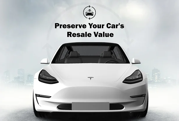 White Tesla parked in a foggy cityscape with the text “Preserve Your Car’s Resale Value” above it